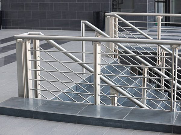 architectural details, modern stainless steel balustrade, and black marble floor